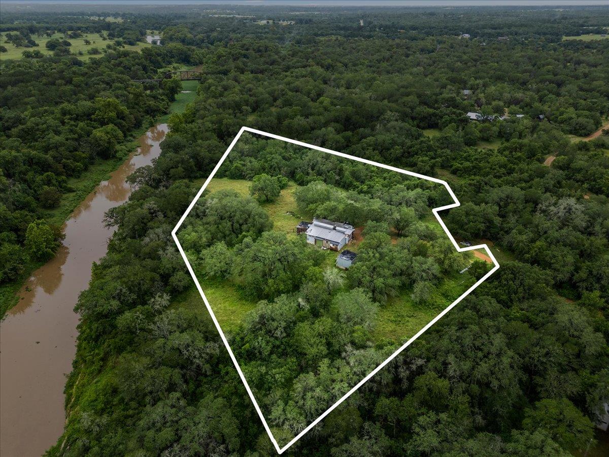A secluded dwelling nestled amidst verdant trees,