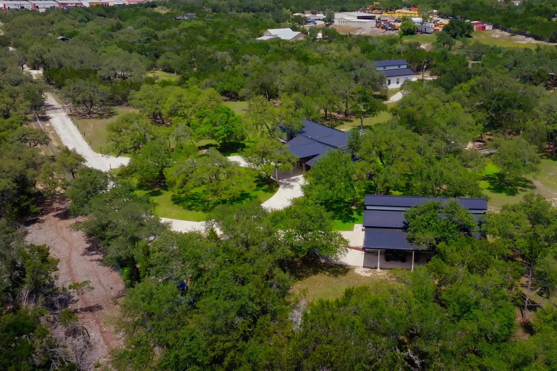 Nestled among a verdant canopy, a private drivewa