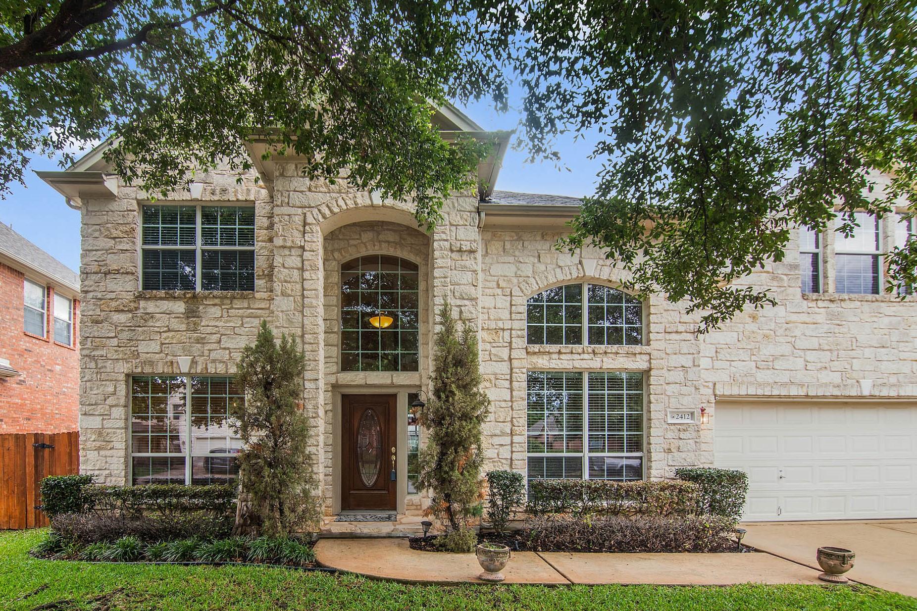 A grand stone facade welcomes guests to this dist