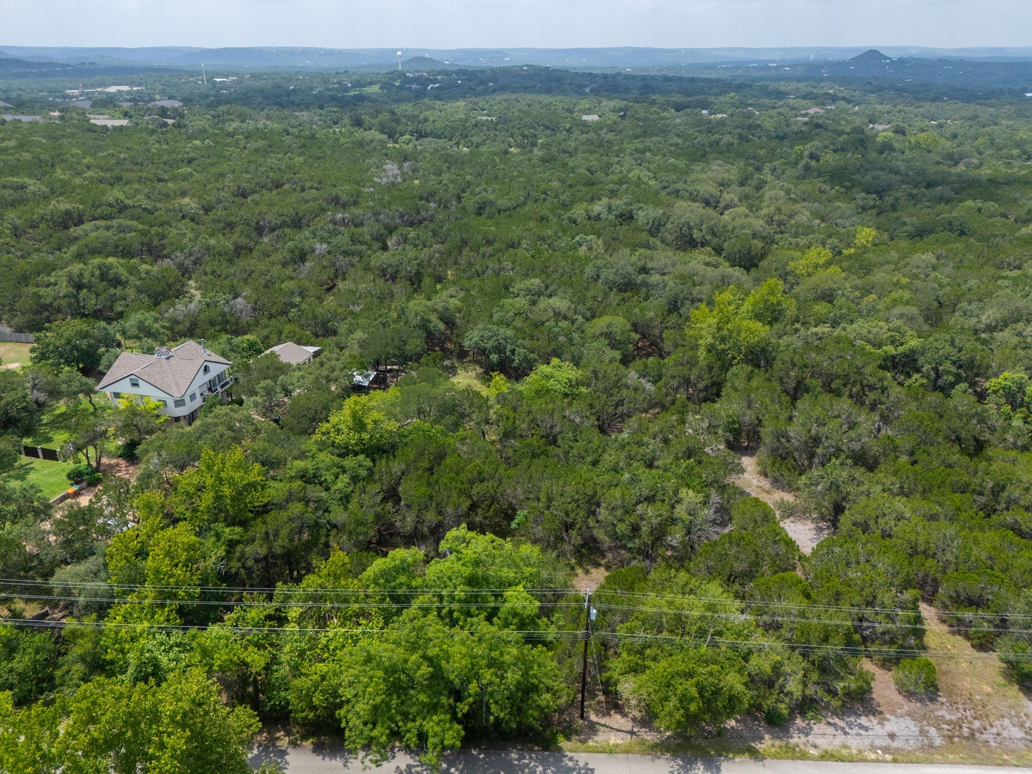 Vast green landscape with residential areas and d