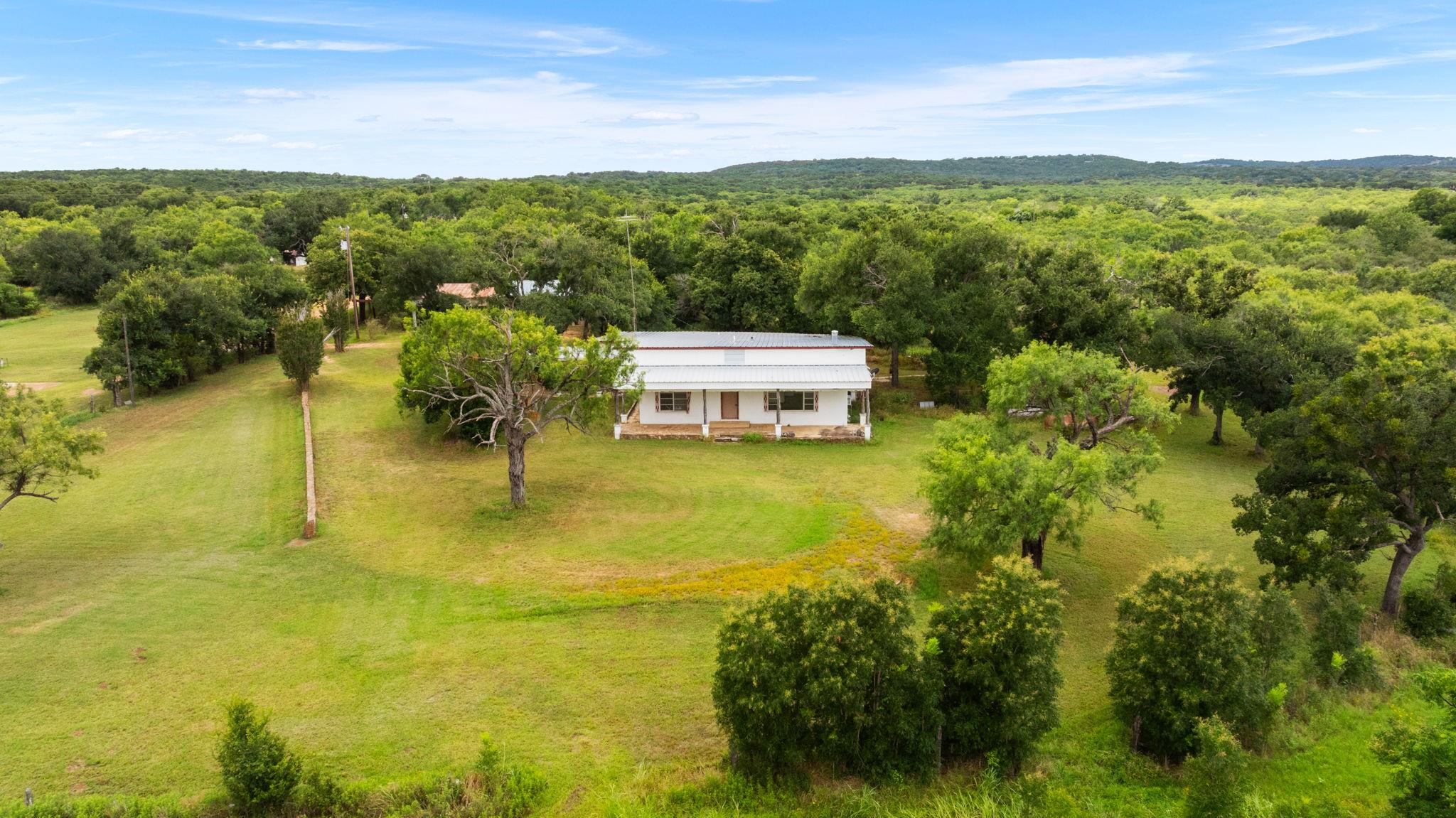A private oasis on a sprawling green lot surround