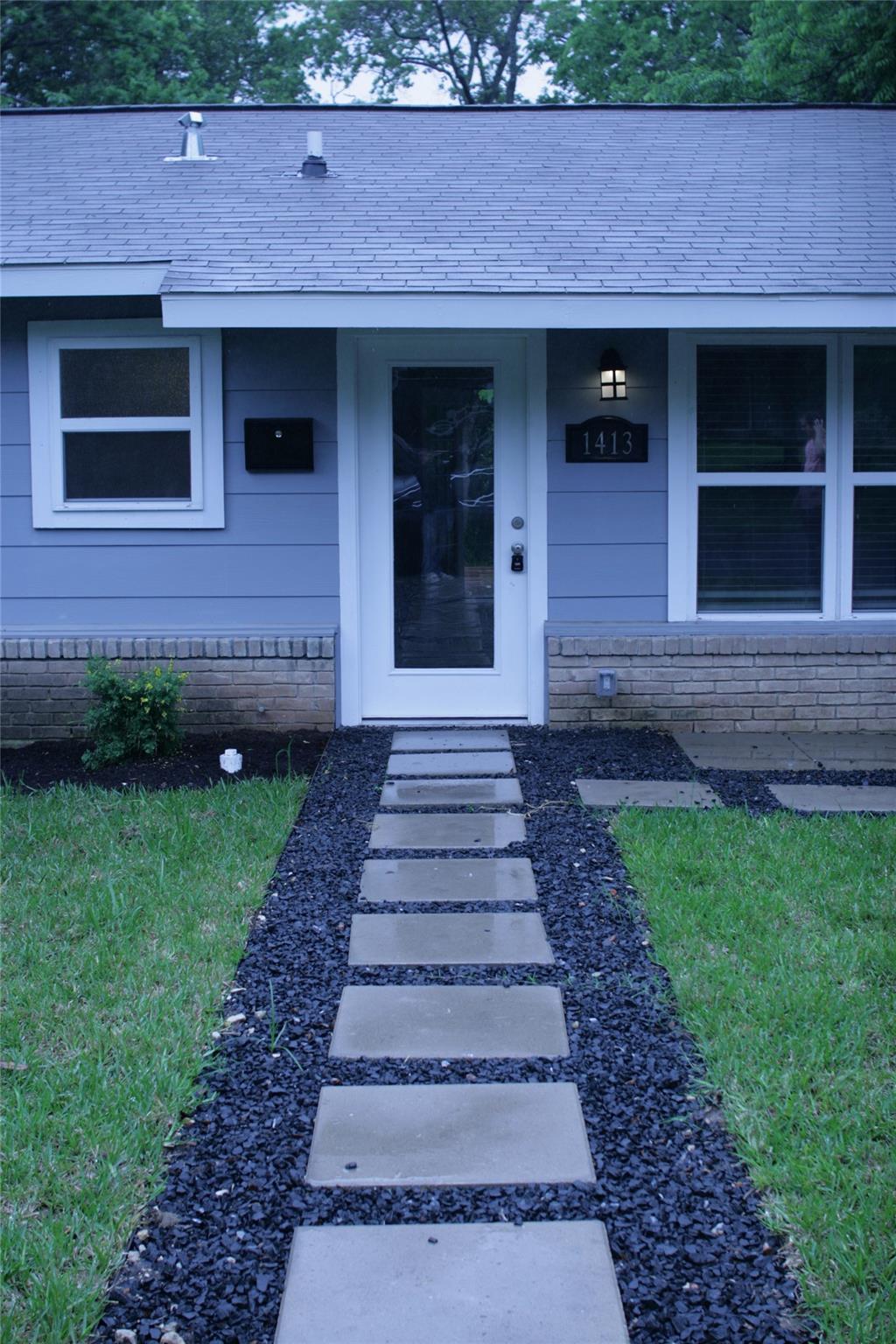 A quaint residence features a contemporary steppi