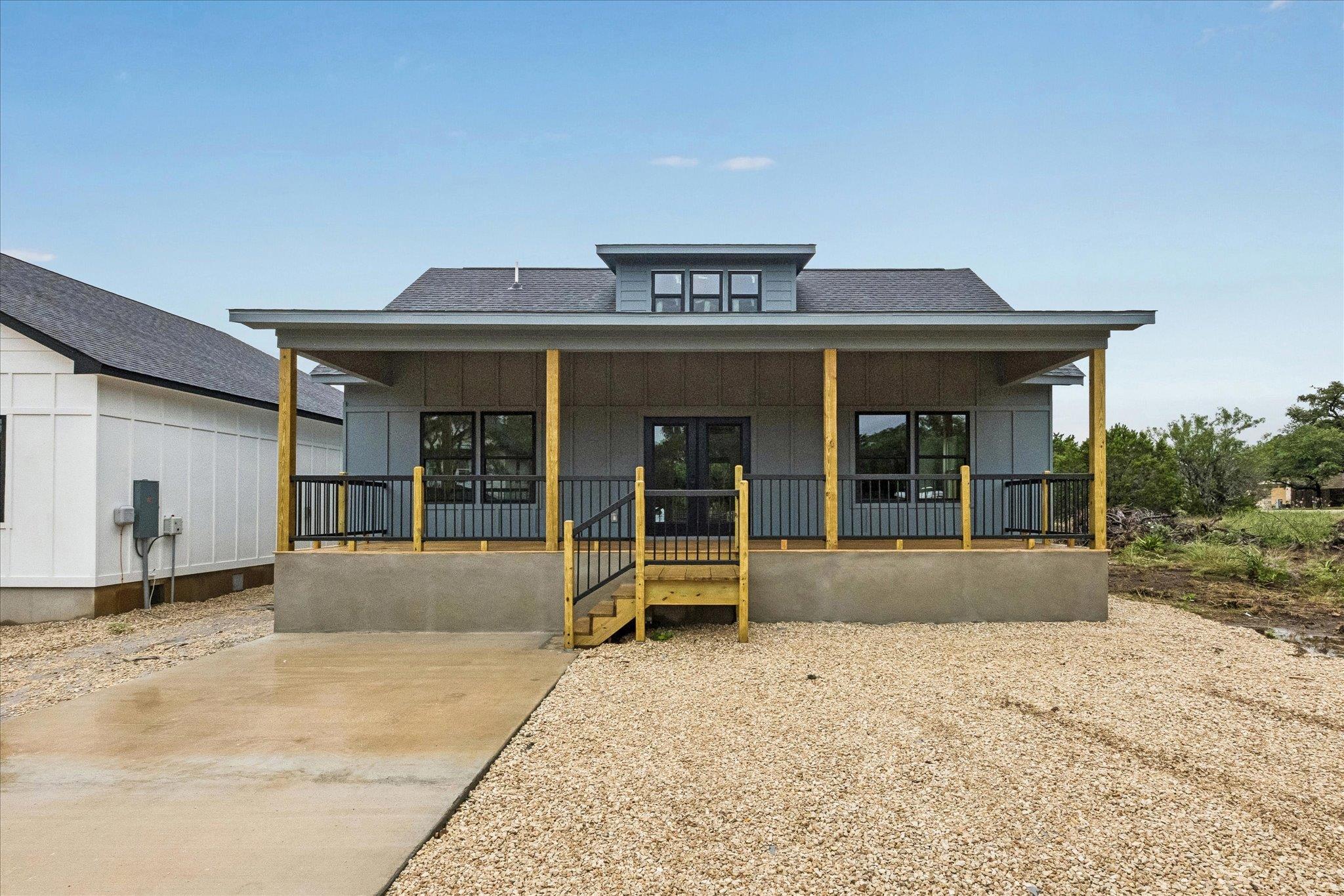 A newly constructed residence showcases a welcomi