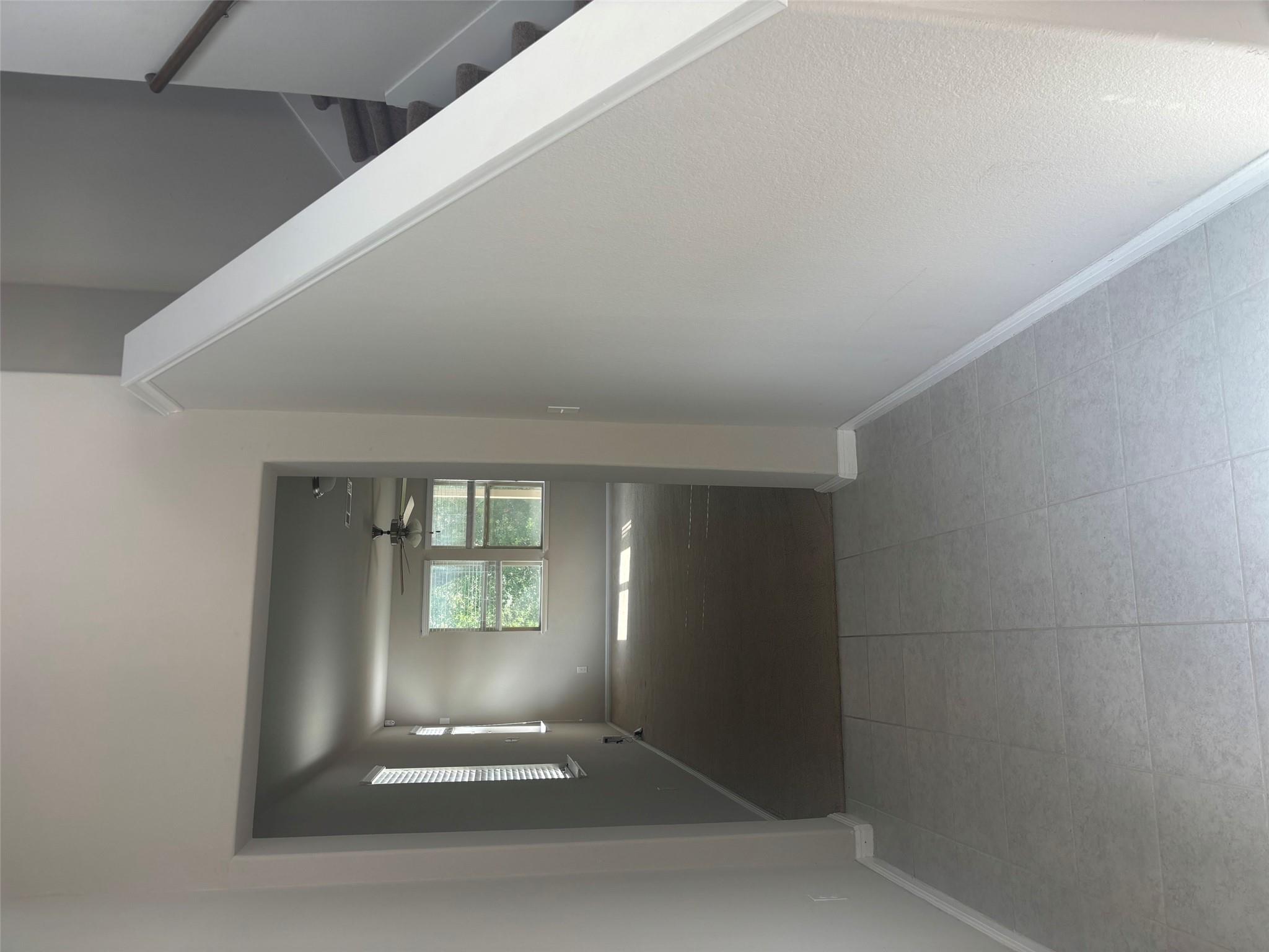 A welcoming entryway with tile flooring leads to 