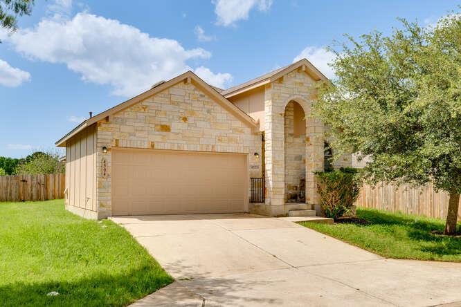 A classic stone facade with an arched entry and a