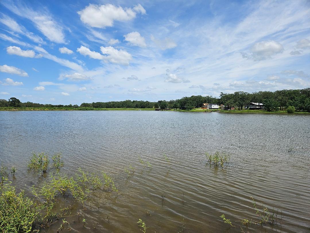 A tranquil lake offers serene waterfront living, 