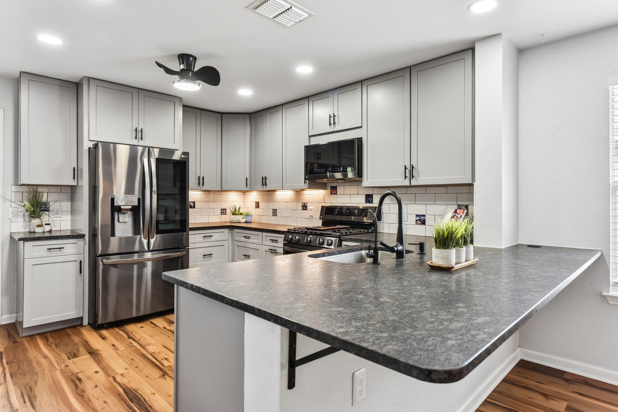 Culinary delights await in this modern kitchen wi