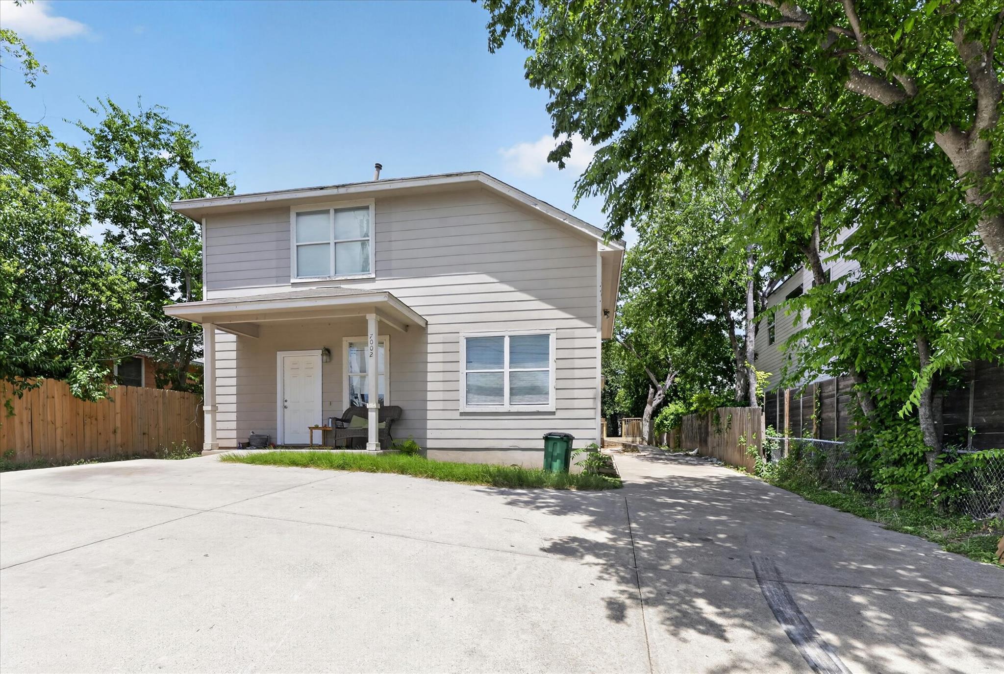A classic two-story residence with a welcoming fr