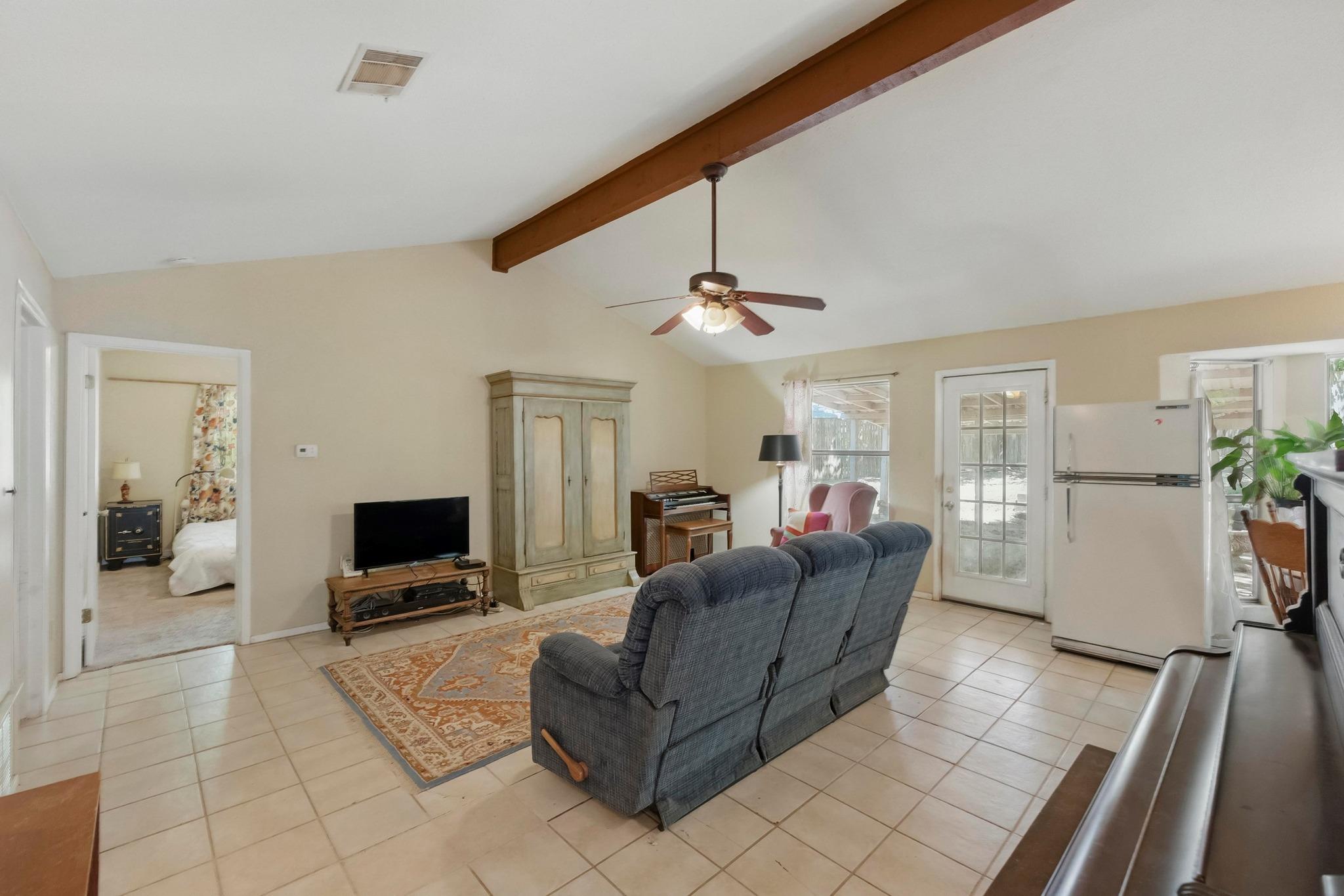 A comfortable living space featuring vaulted ceil