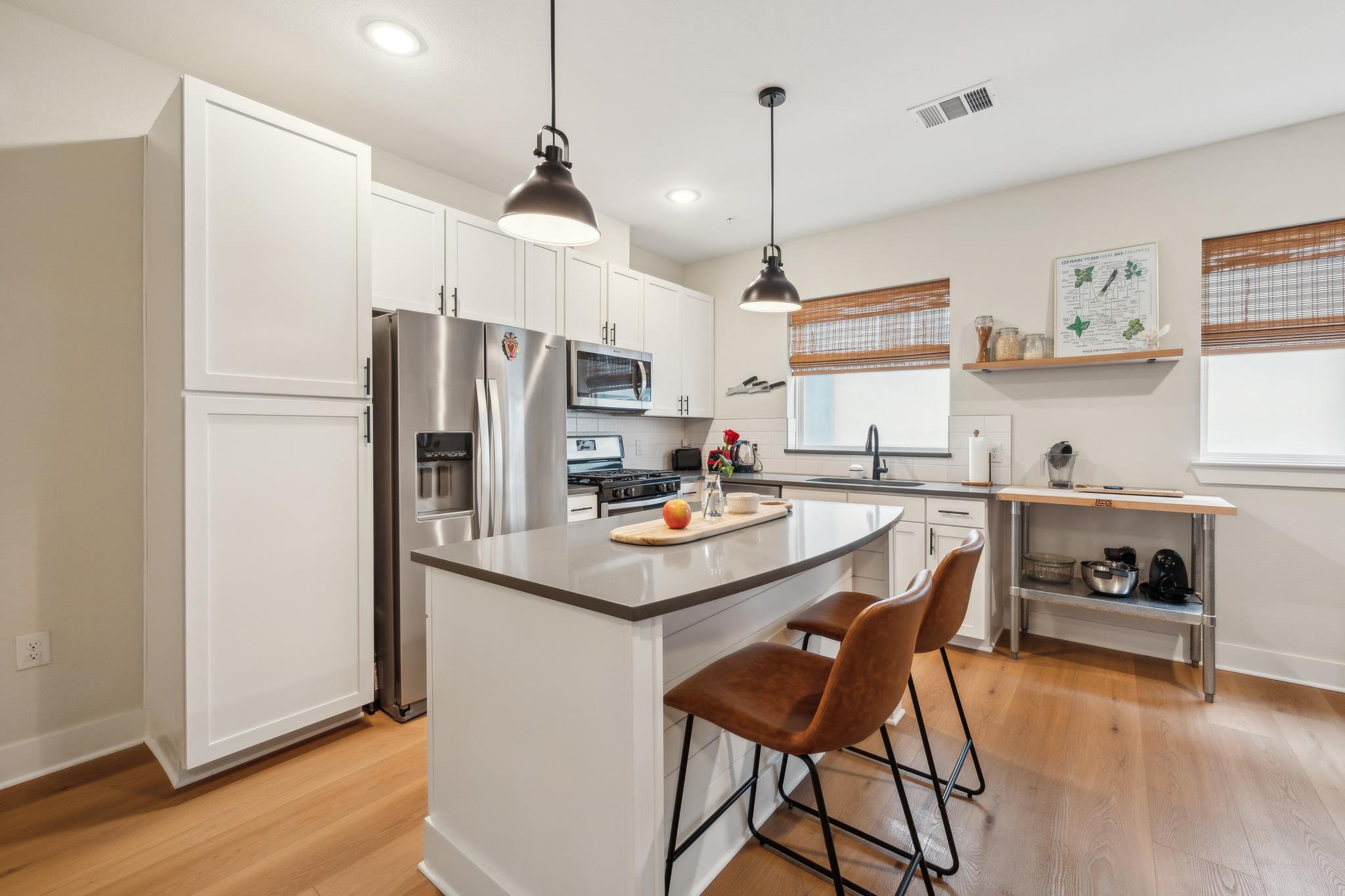 Culinary delights await in this bright kitchen, c