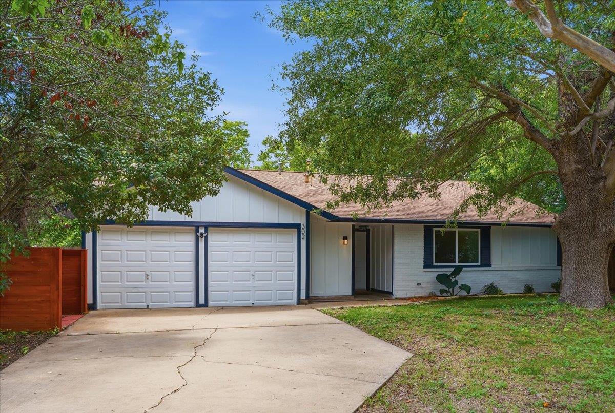 A well-maintained facade with a two-car garage an