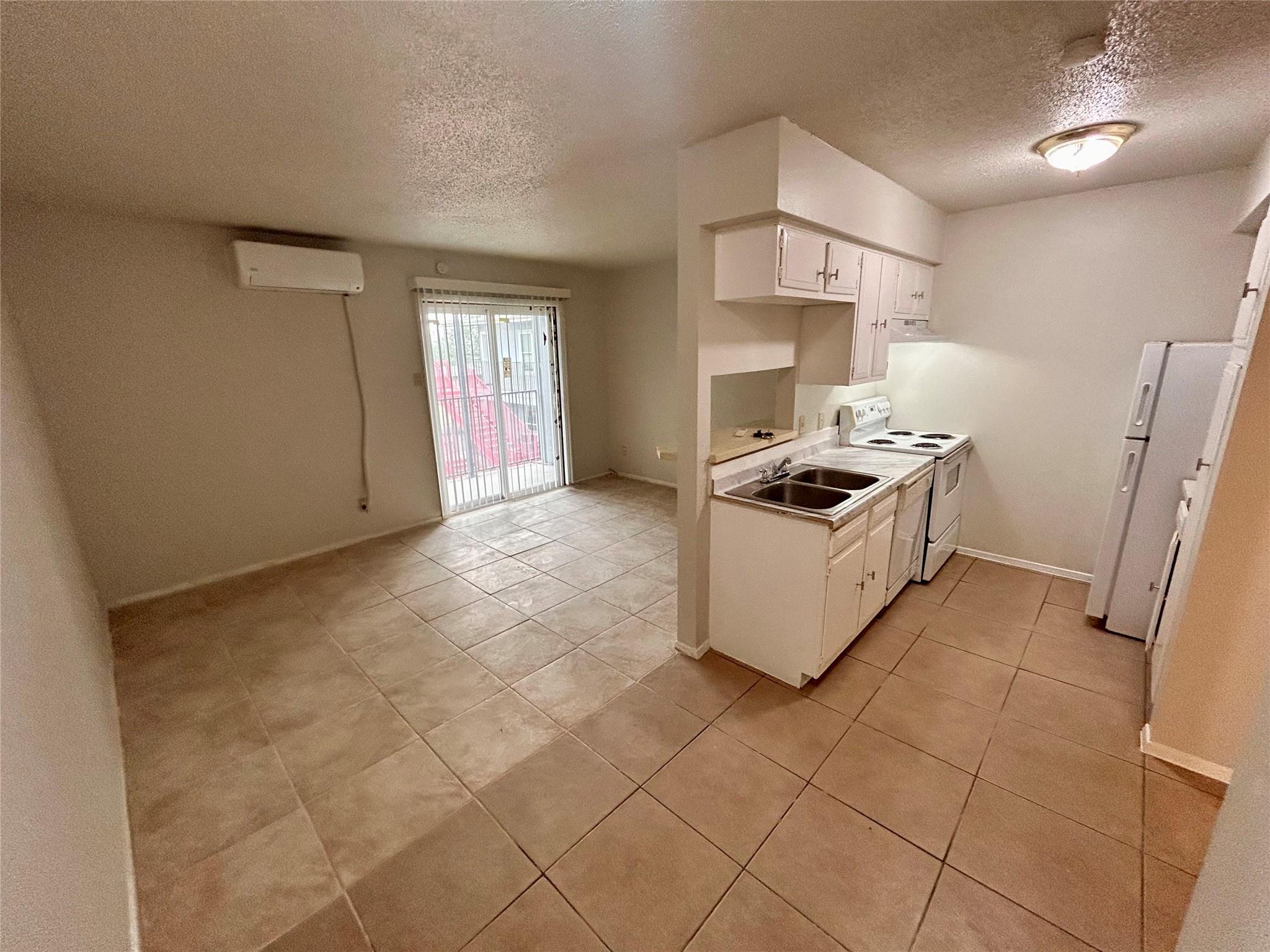 Functional kitchen with ample cabinet space opens