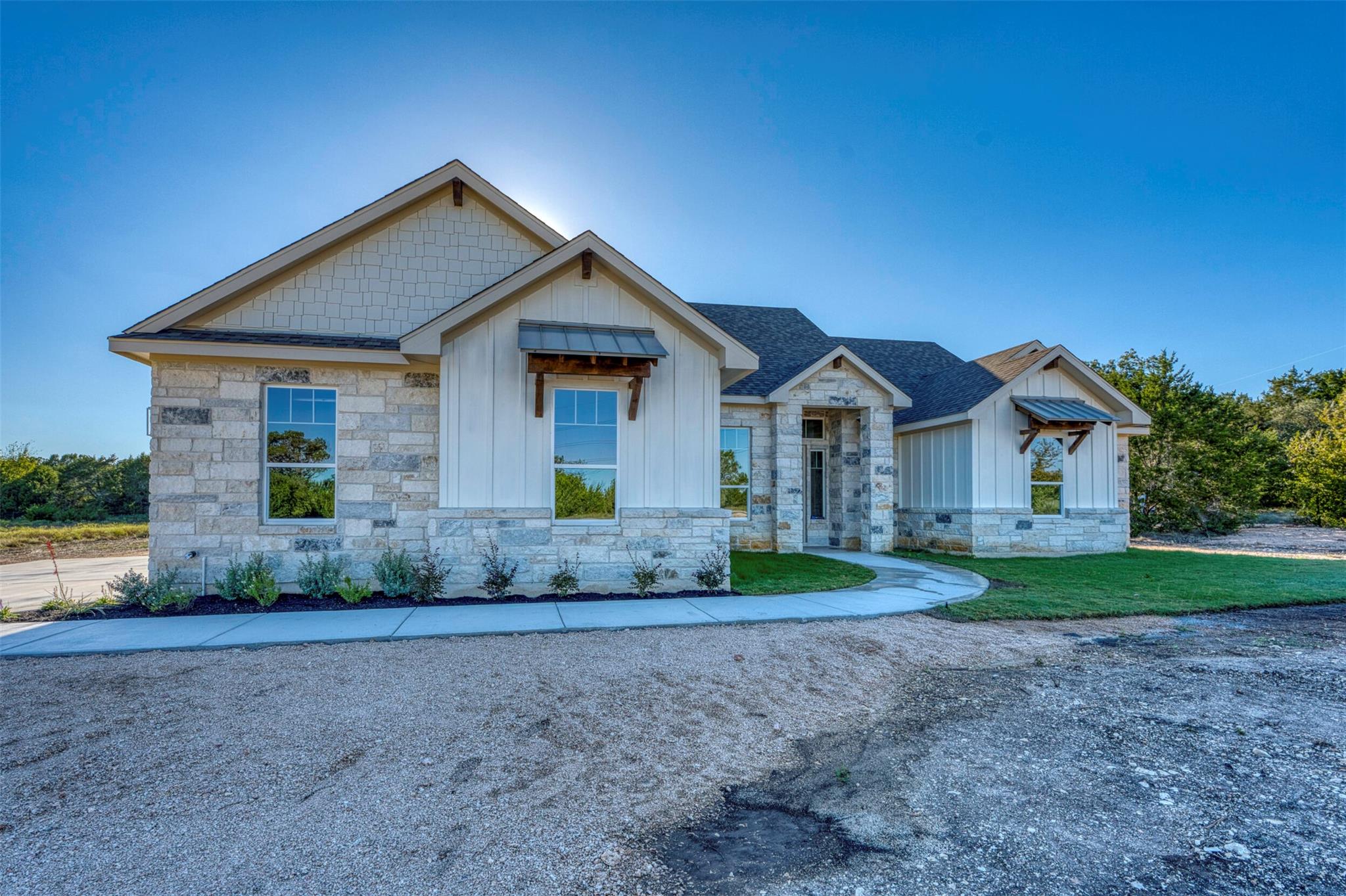 Stone and board-and-batten siding define this mod