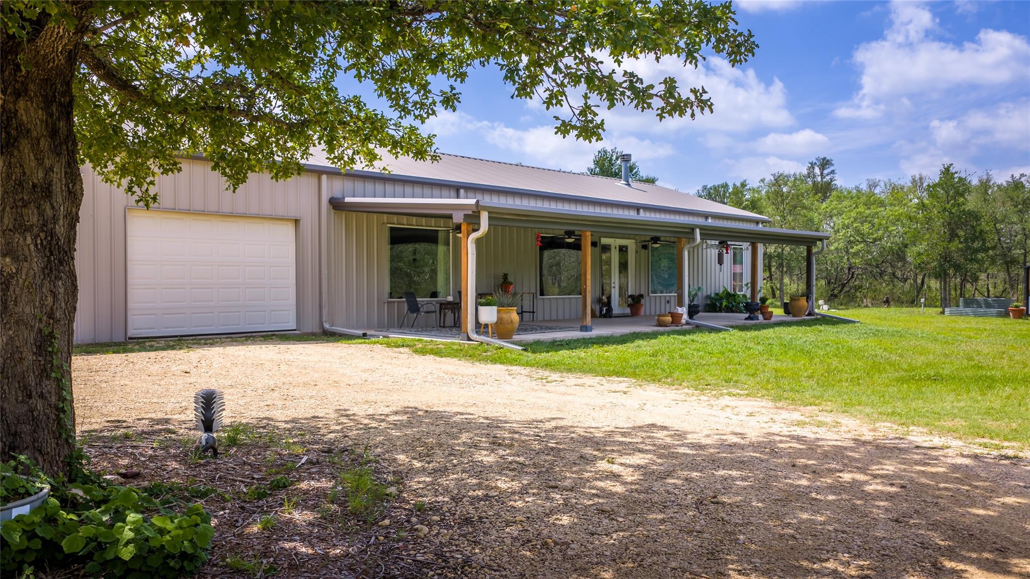 A welcoming front porch extends across this moder