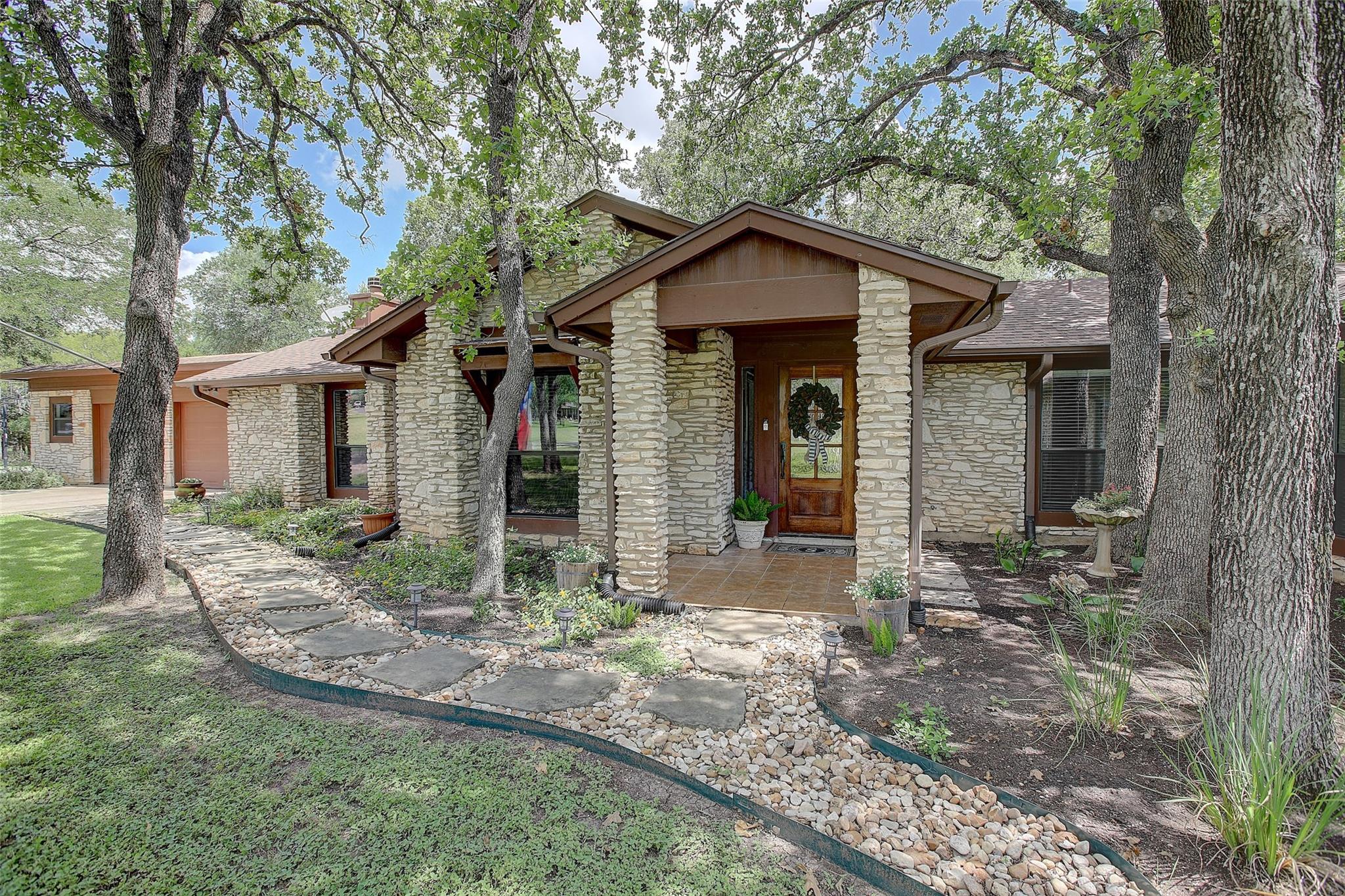 A stone facade welcomes you to this charming resi