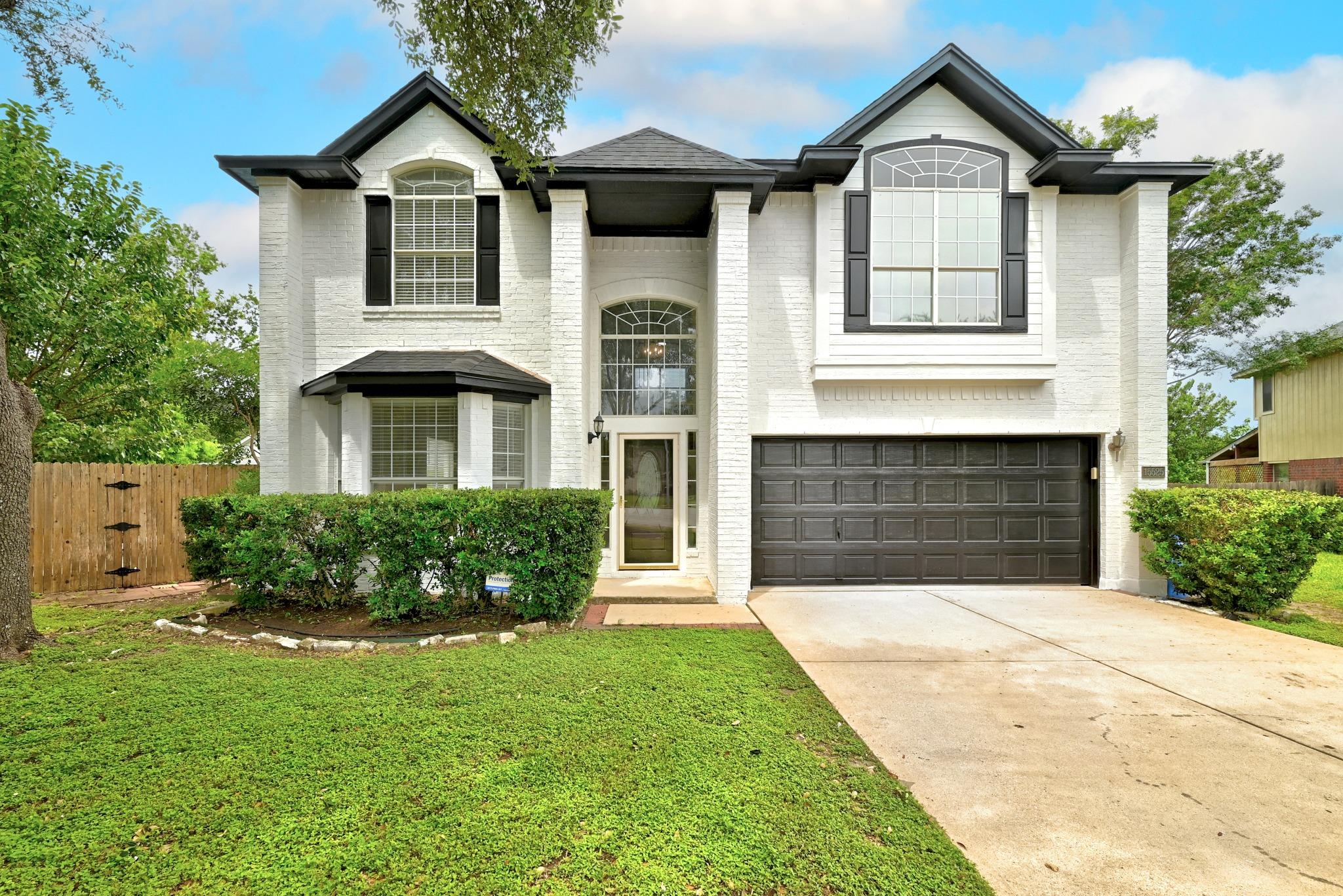 A striking white brick facade with arched windows