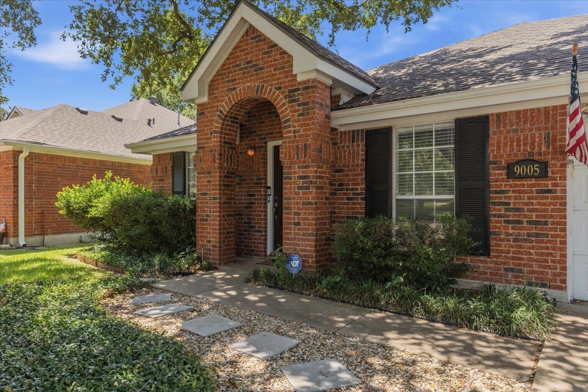 A well-maintained brick exterior with inviting ar