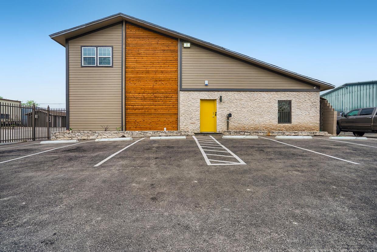 Modern facade featuring a vibrant entry and ample