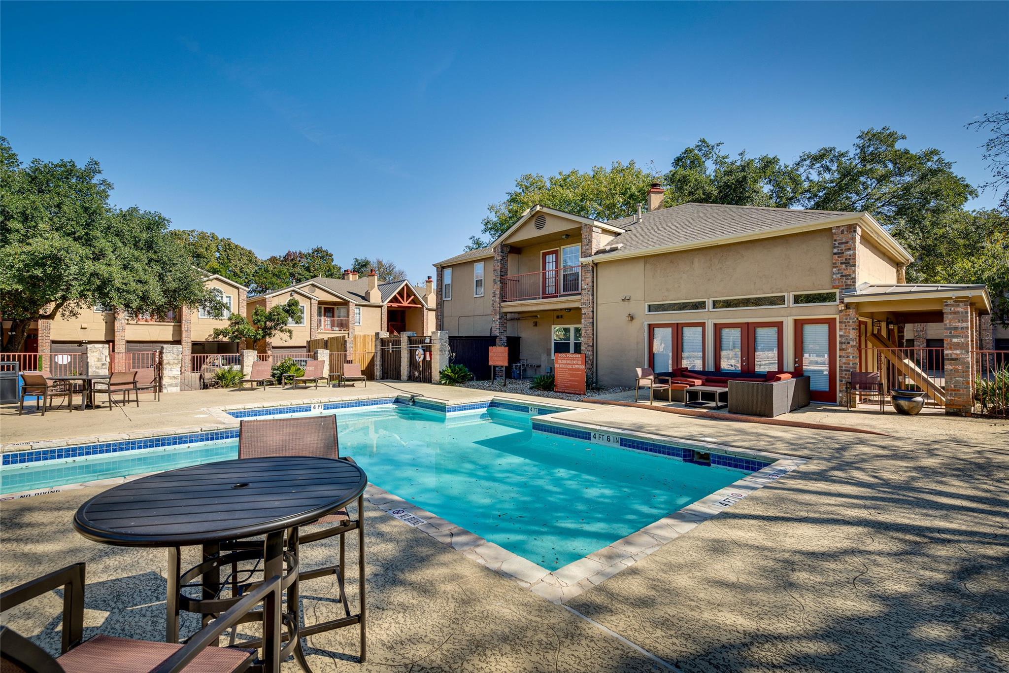 Community swimming pool with a stone coping and a