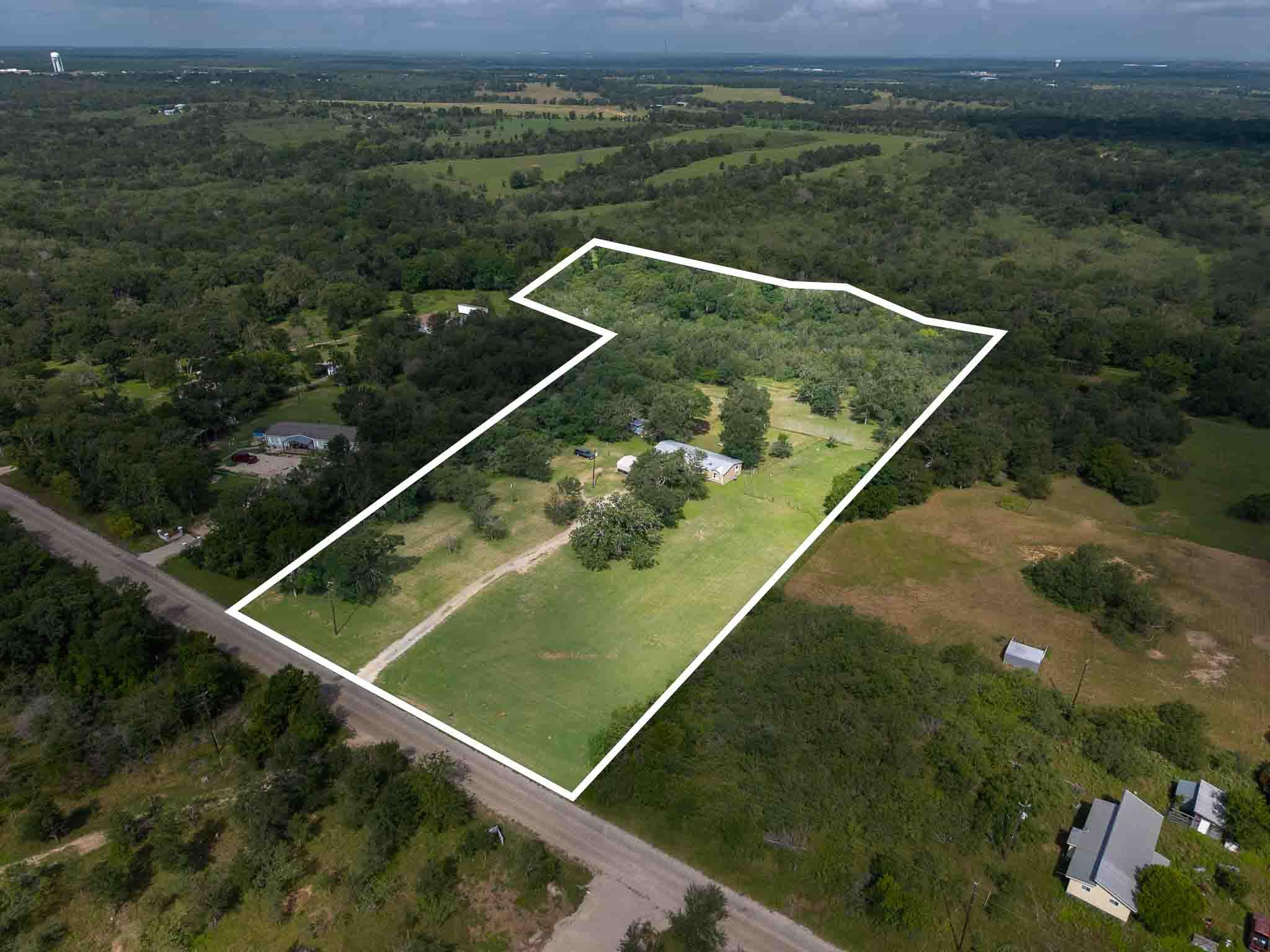 A sweeping aerial view showcases a verdant lot am