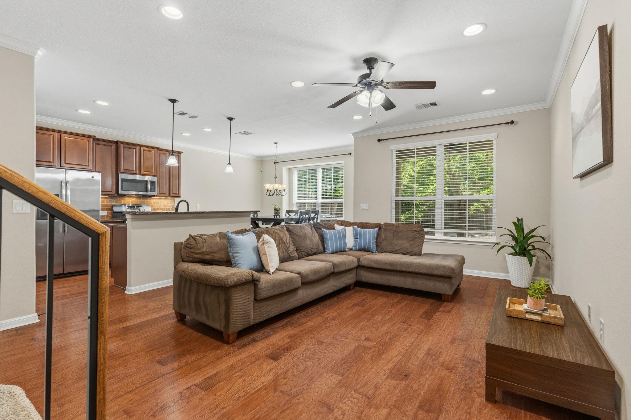 Hardwood floors and generous windows characterize