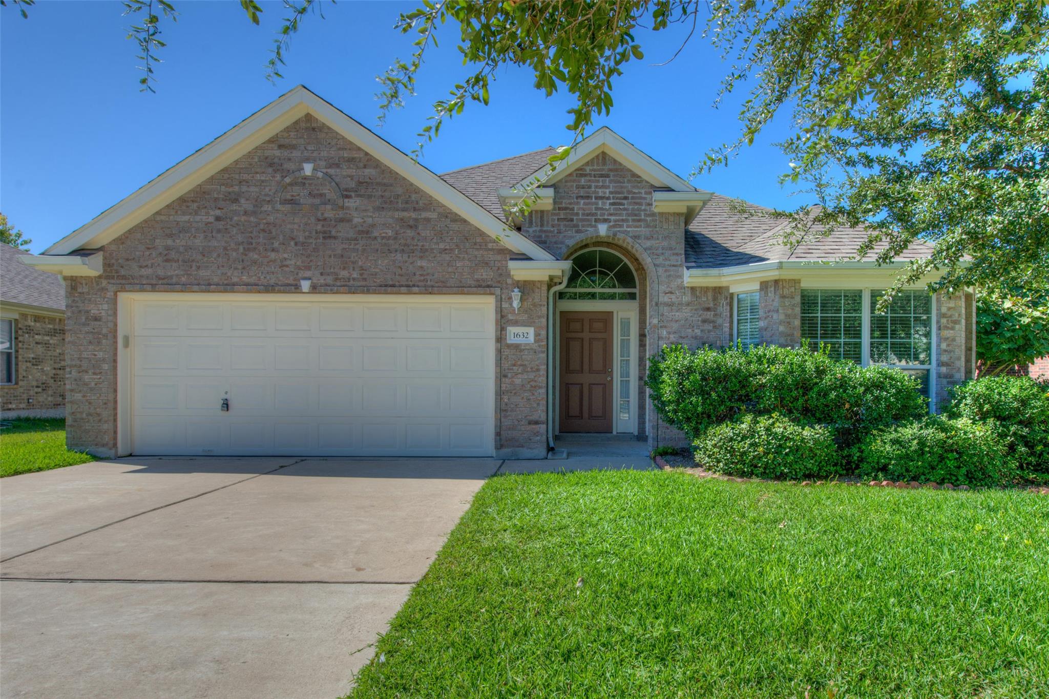 A classic brick exterior with well-maintained lan