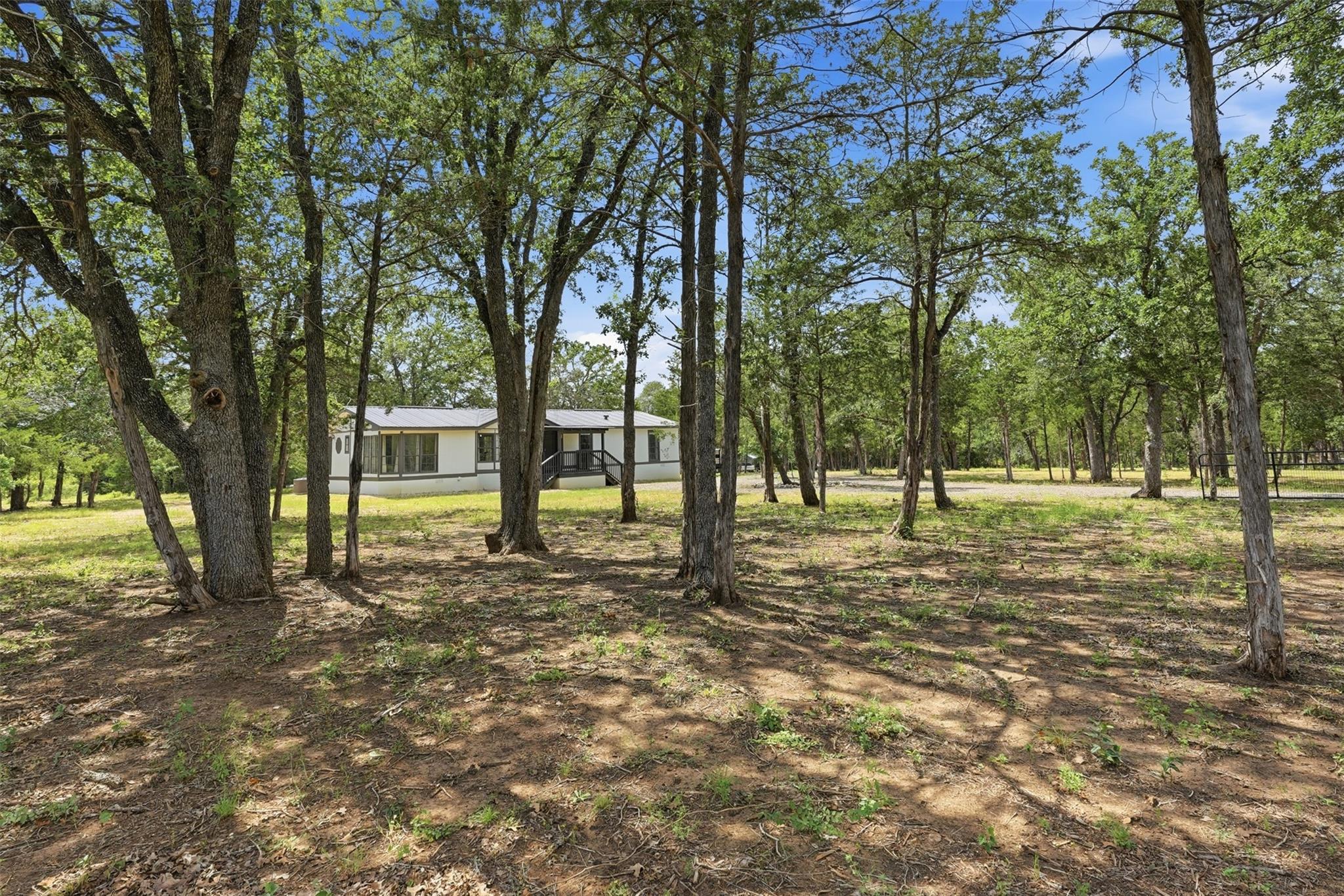 Mature trees shade a peaceful residence nestled i