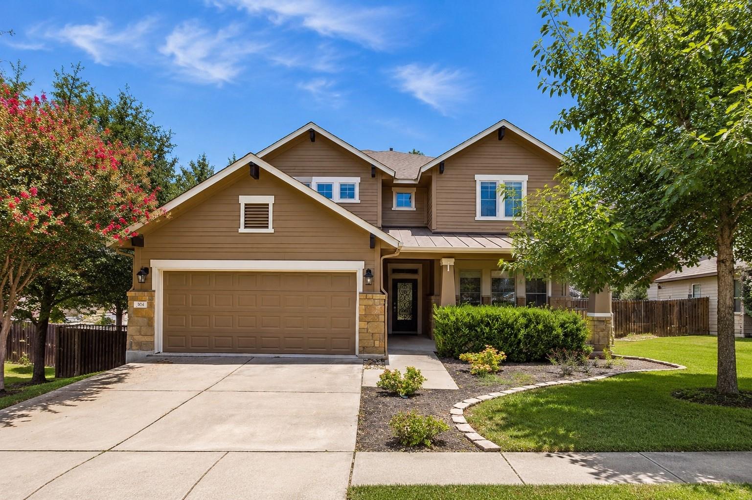 A welcoming front exterior featuring a broad conc