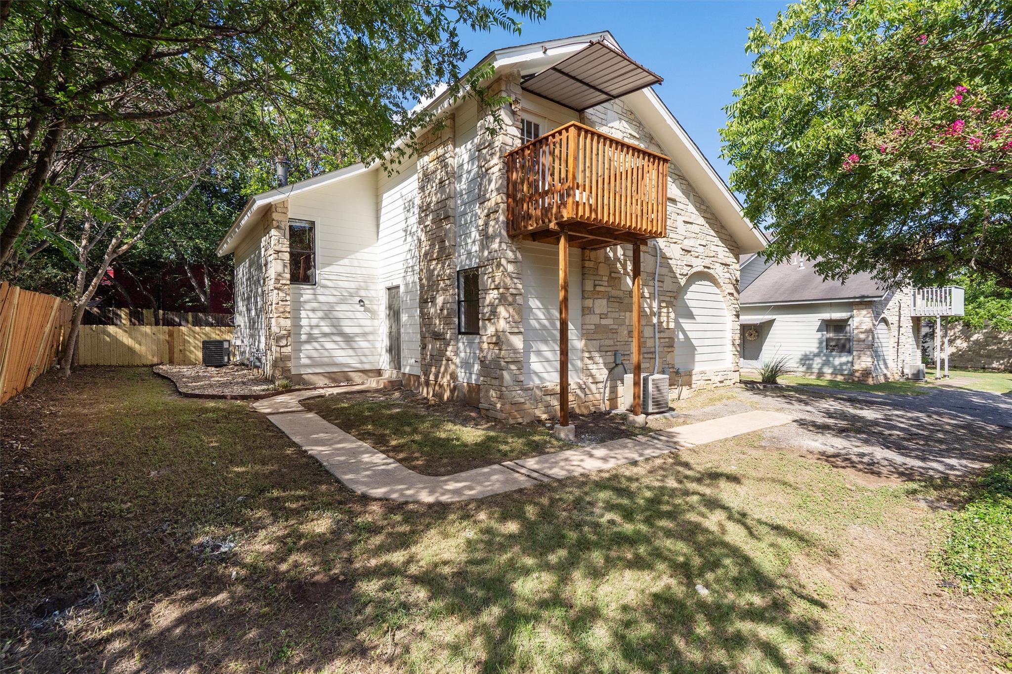 A stone and siding exterior offers curb appeal, c