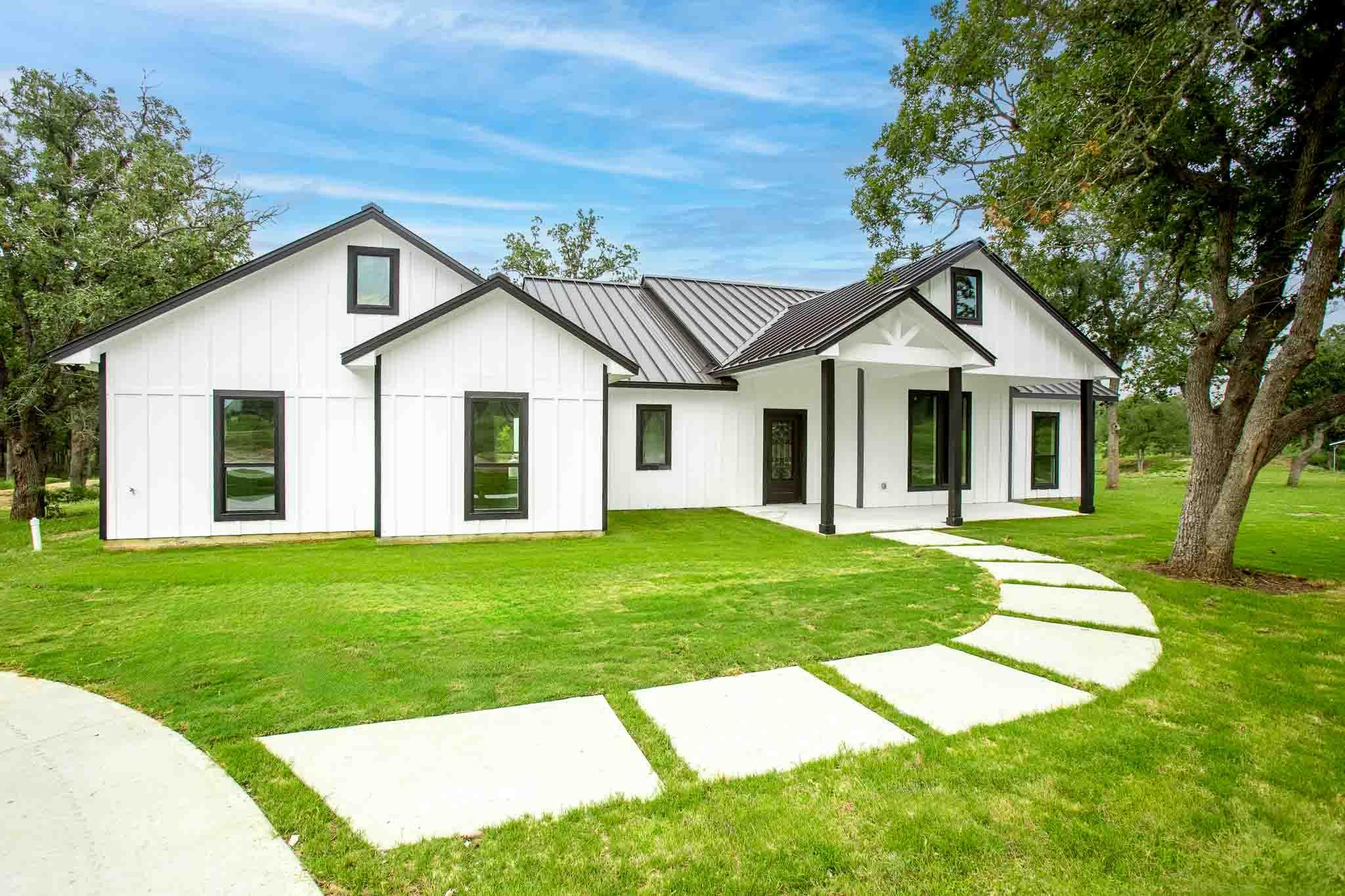 A modern farmhouse design with striking black tri