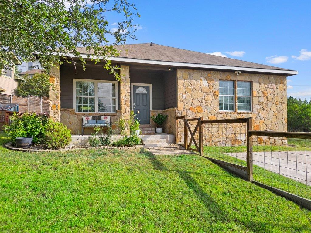A charming stone and siding facade offers invitin