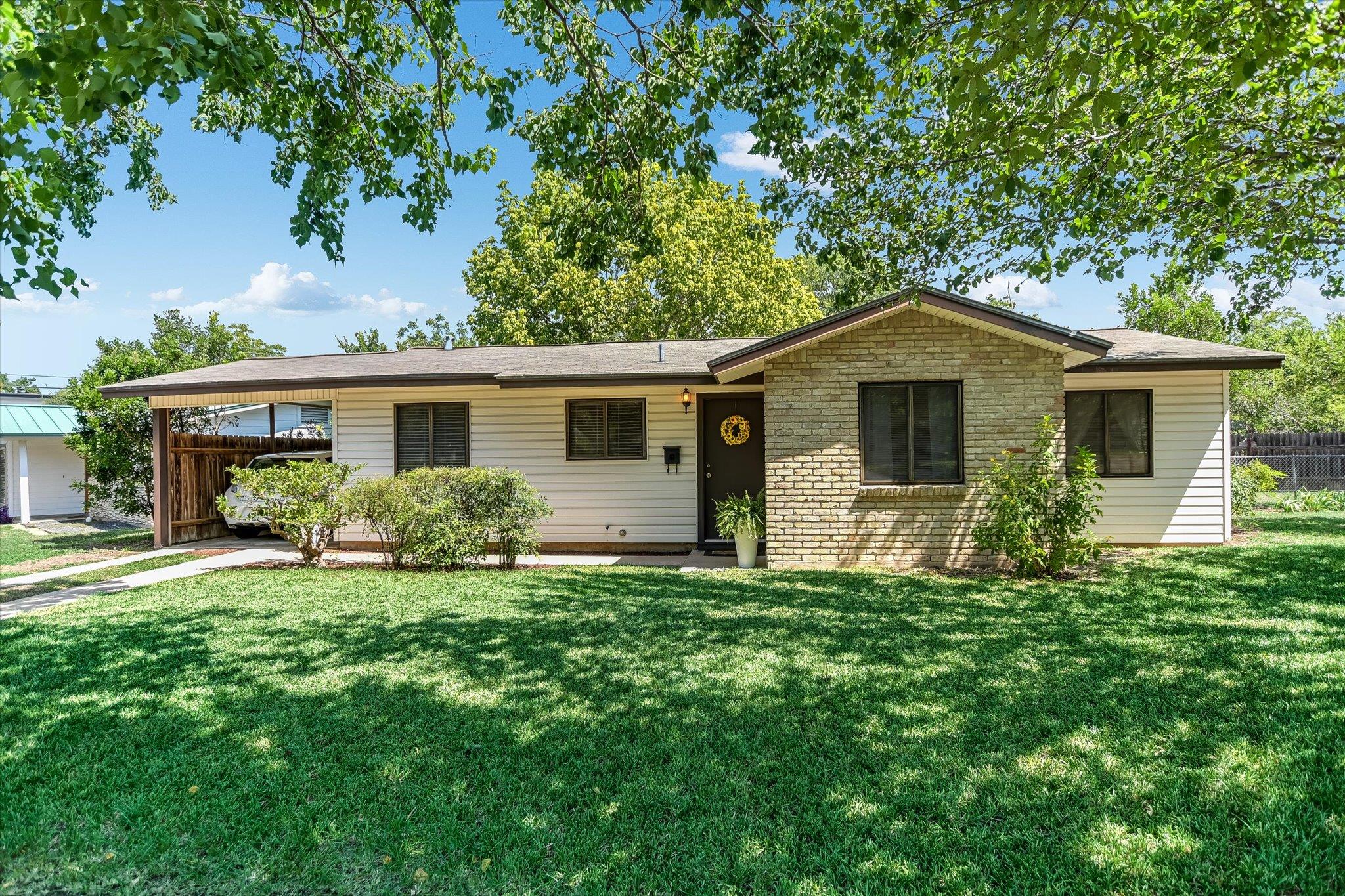 A classic ranch home, blending brick and siding, 