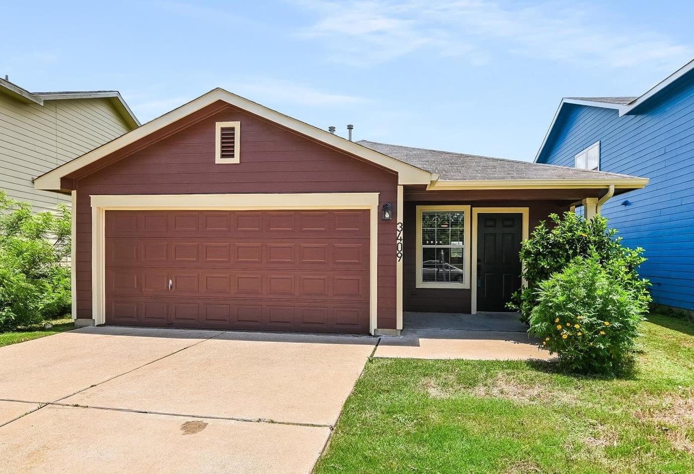 A welcoming facade with a convenient garage and n