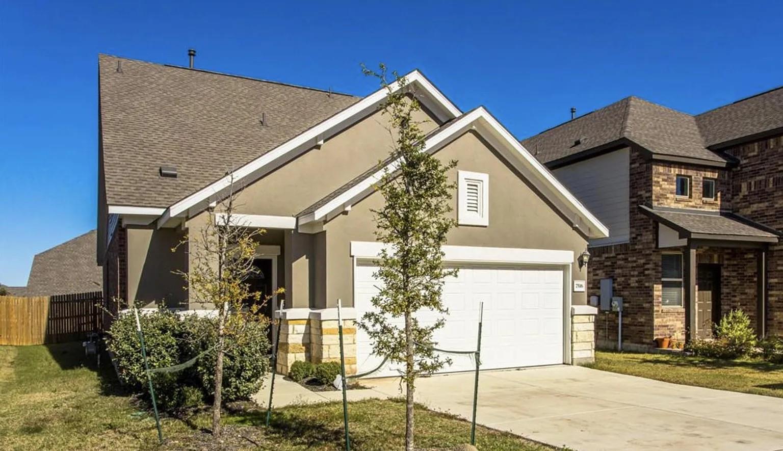 View of front of home featuring stucco siding, a 