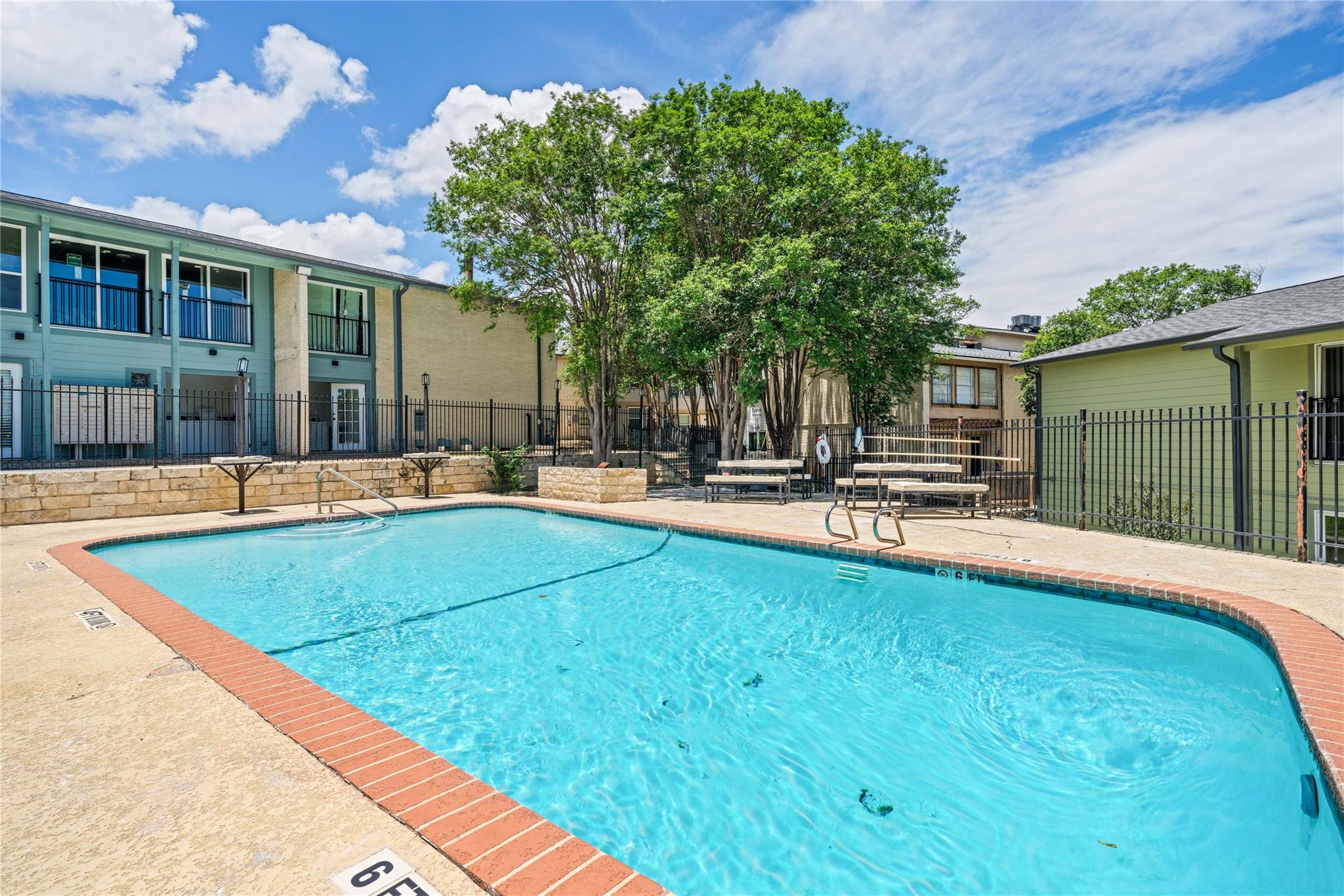 A refreshing pool awaits, nestled amidst well-mai