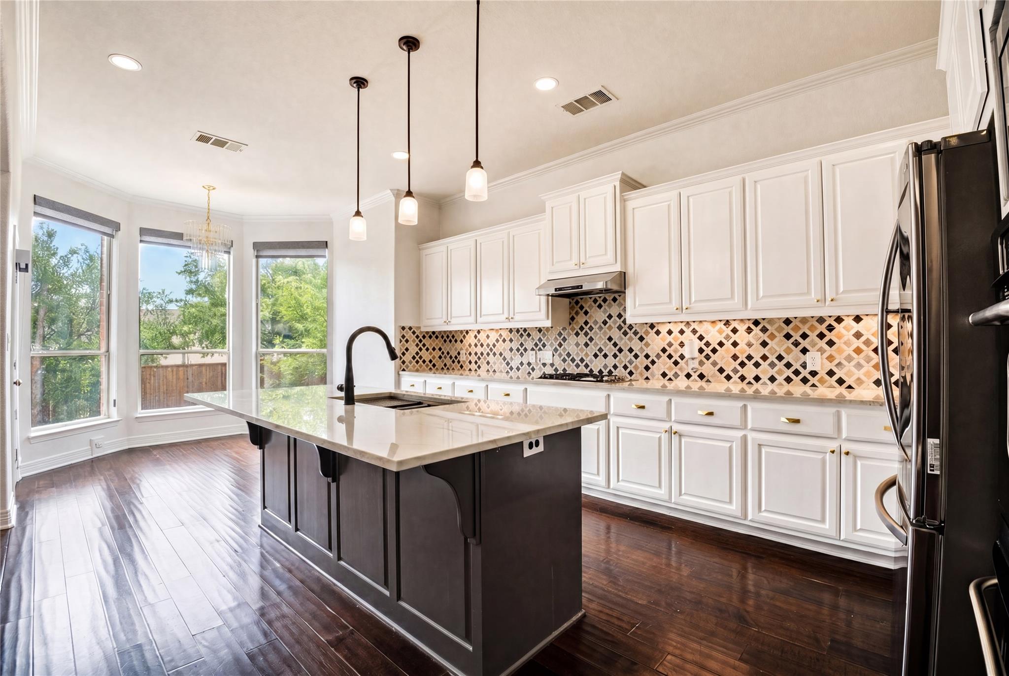 A well-appointed kitchen showcasing a spacious is