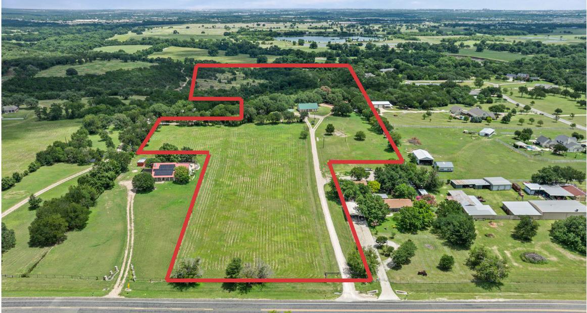 An aerial panorama reveals sprawling acreage with