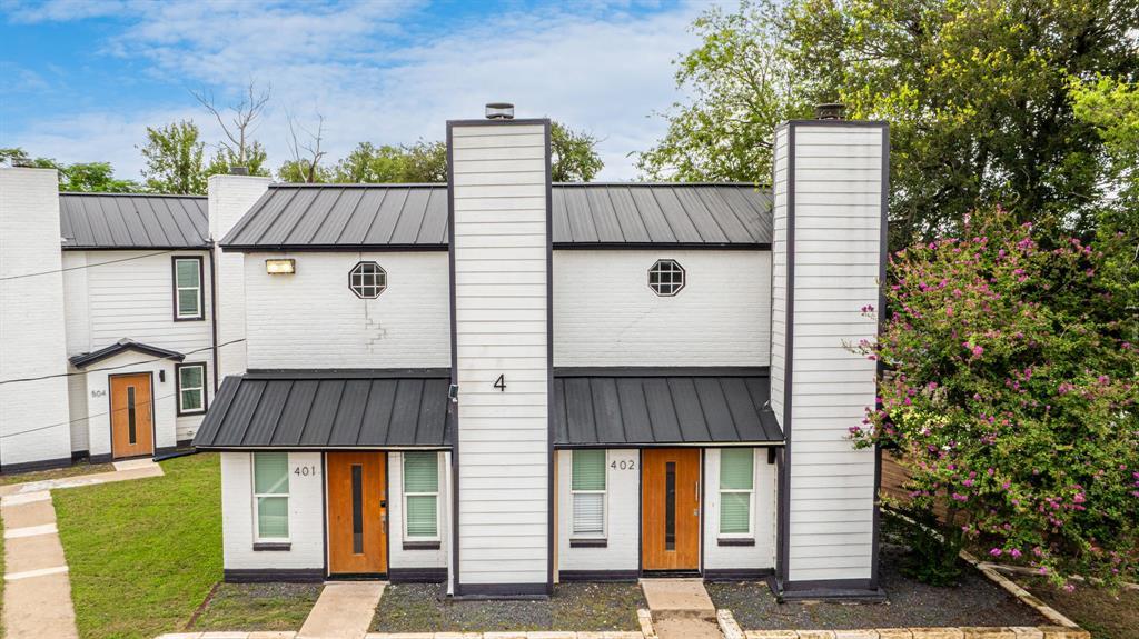 Bold black and white townhome exteriors with rich