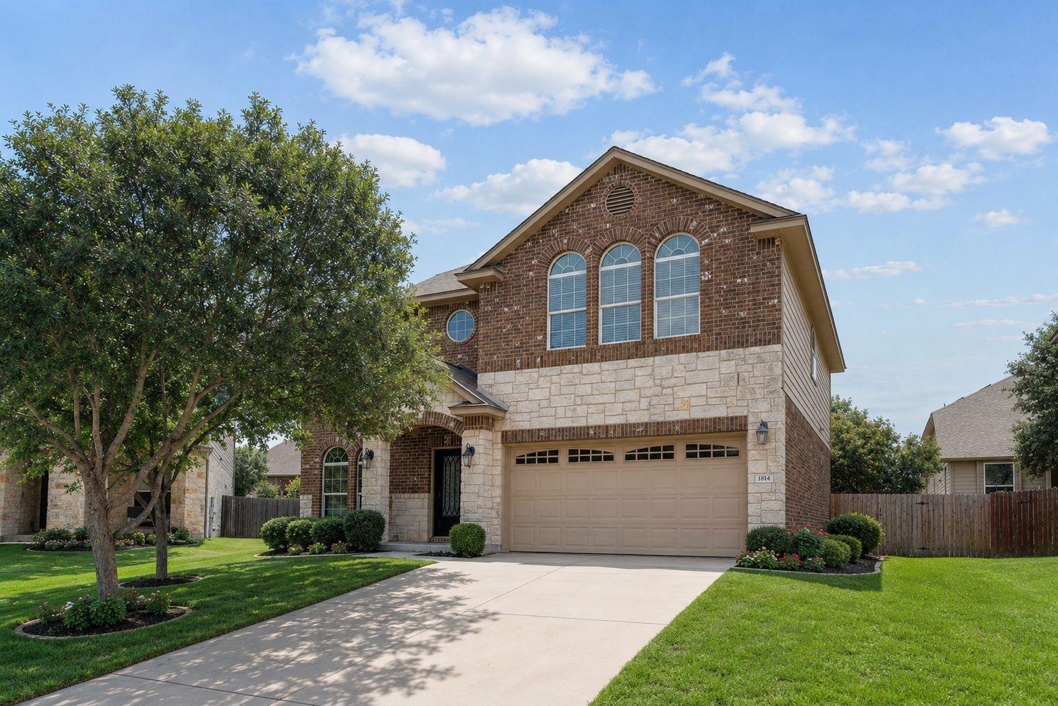 A classic brick and stone facade welcomes with an