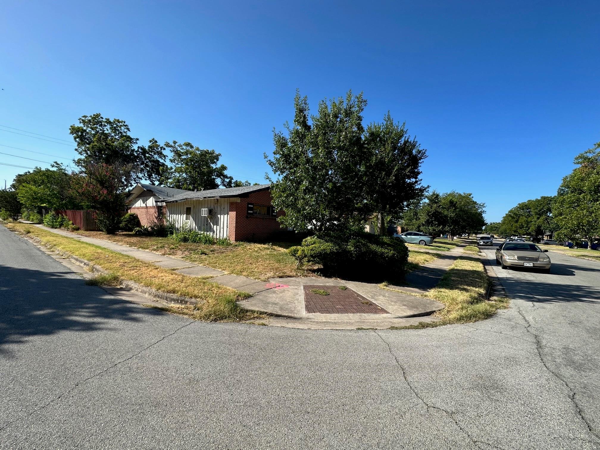 A corner lot residence, featuring a combination o
