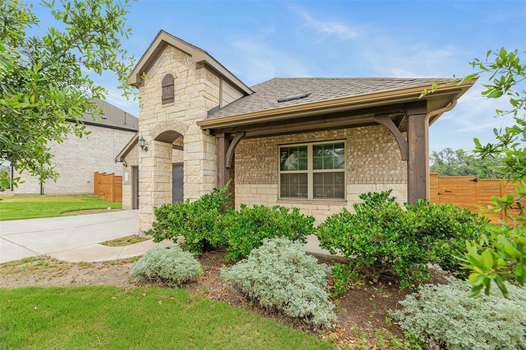 French country home with roof with shingles, conc