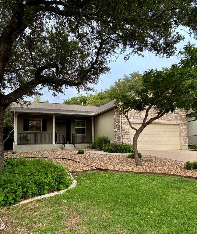 A welcoming stone and stucco exterior, nestled am