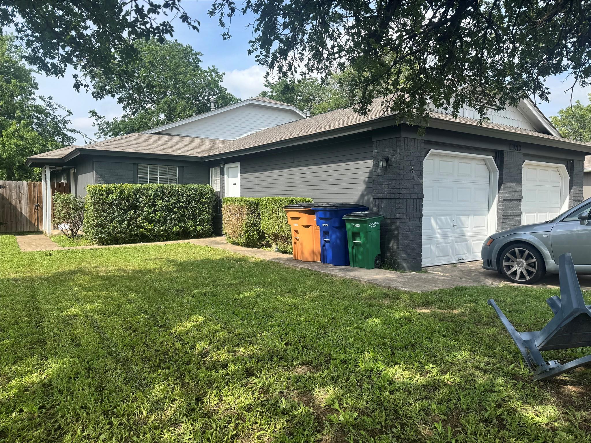 A well-maintained lawn introduces this inviting r