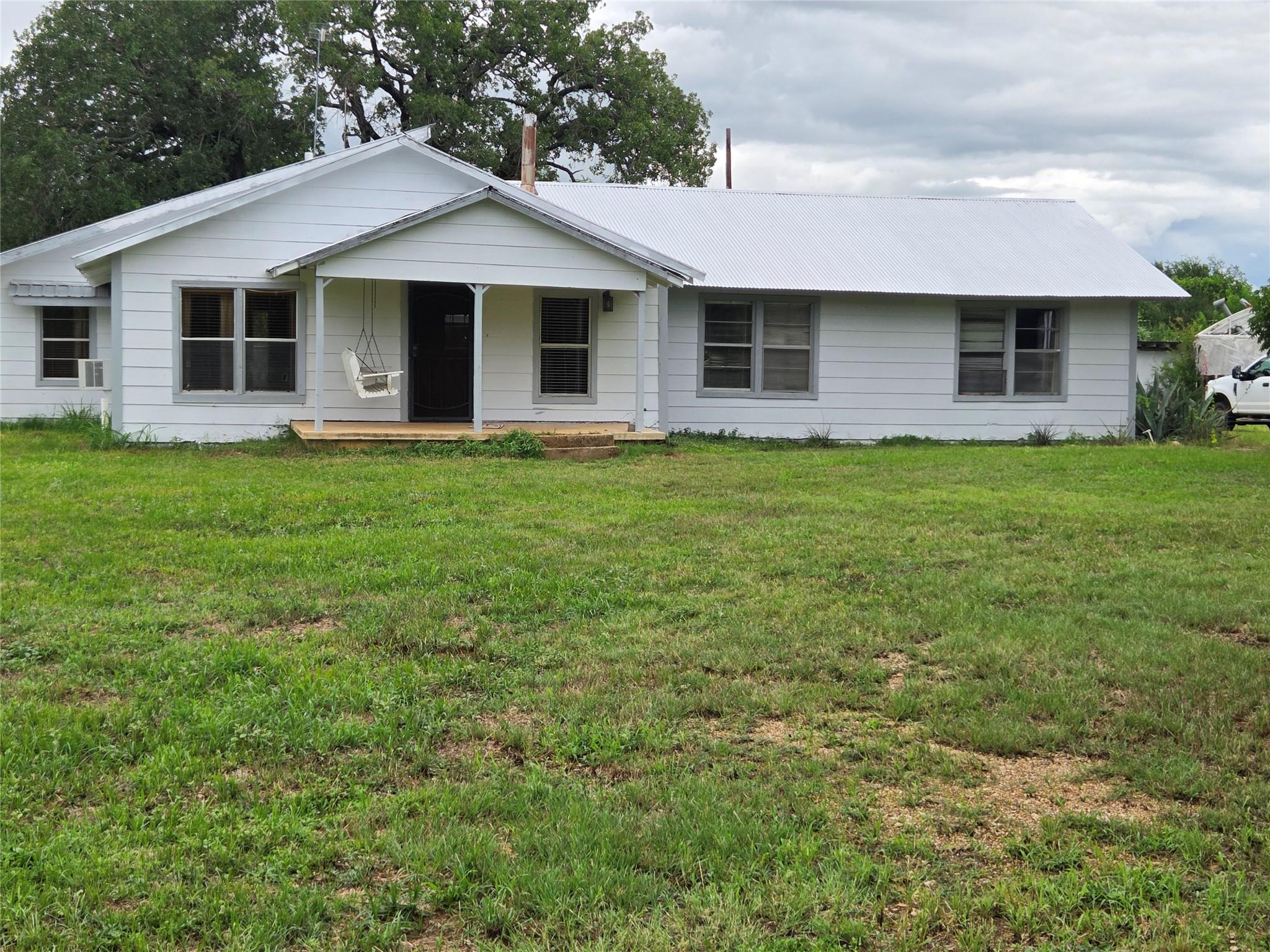 A classic facade with a welcoming covered porch, 