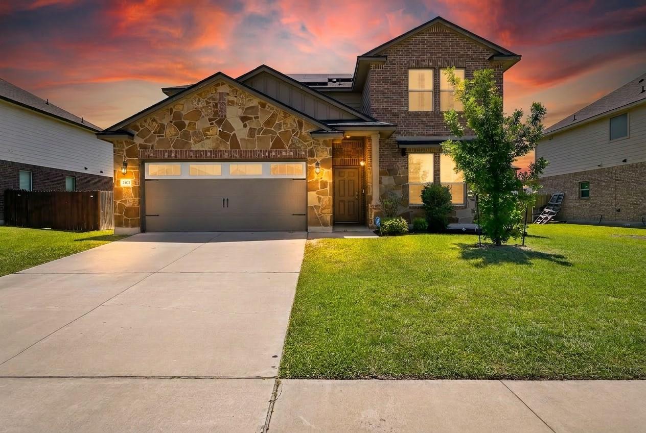 A striking facade with varied brick and stone ele