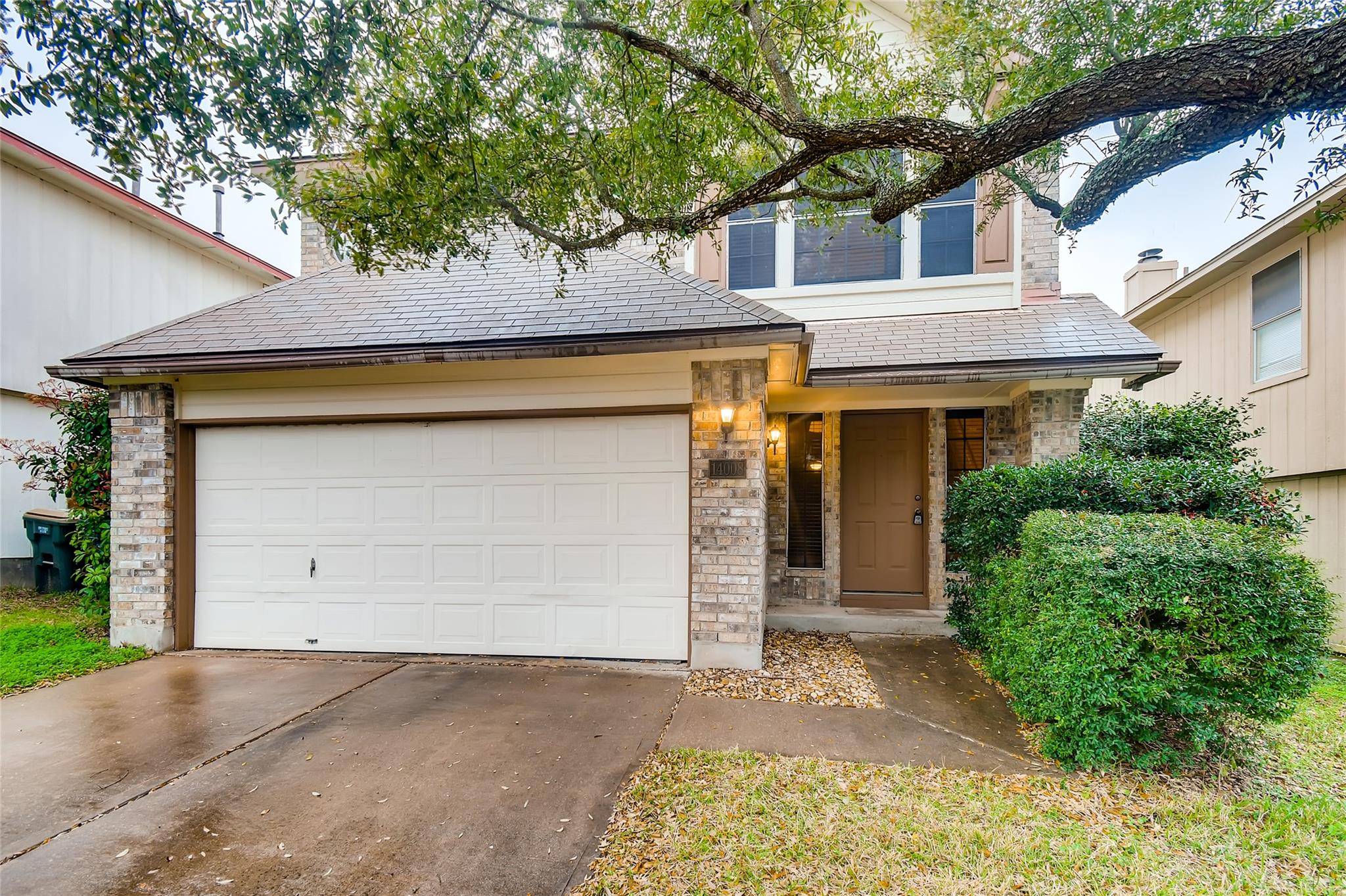 A classic brick-front residence with an attached 