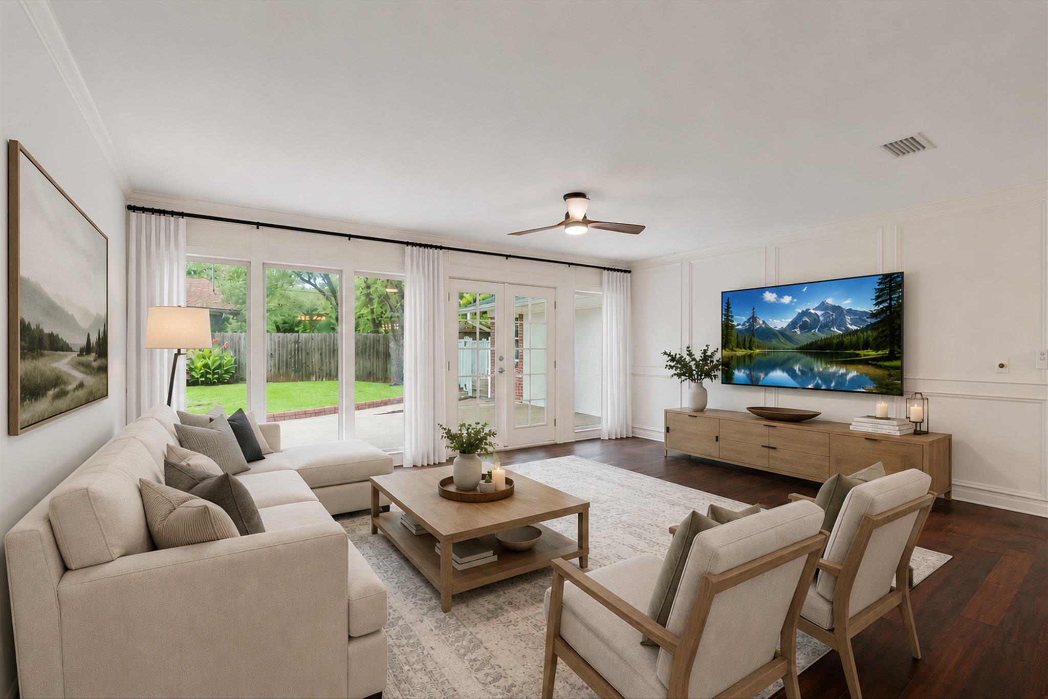 French doors and large windows invite natural lig