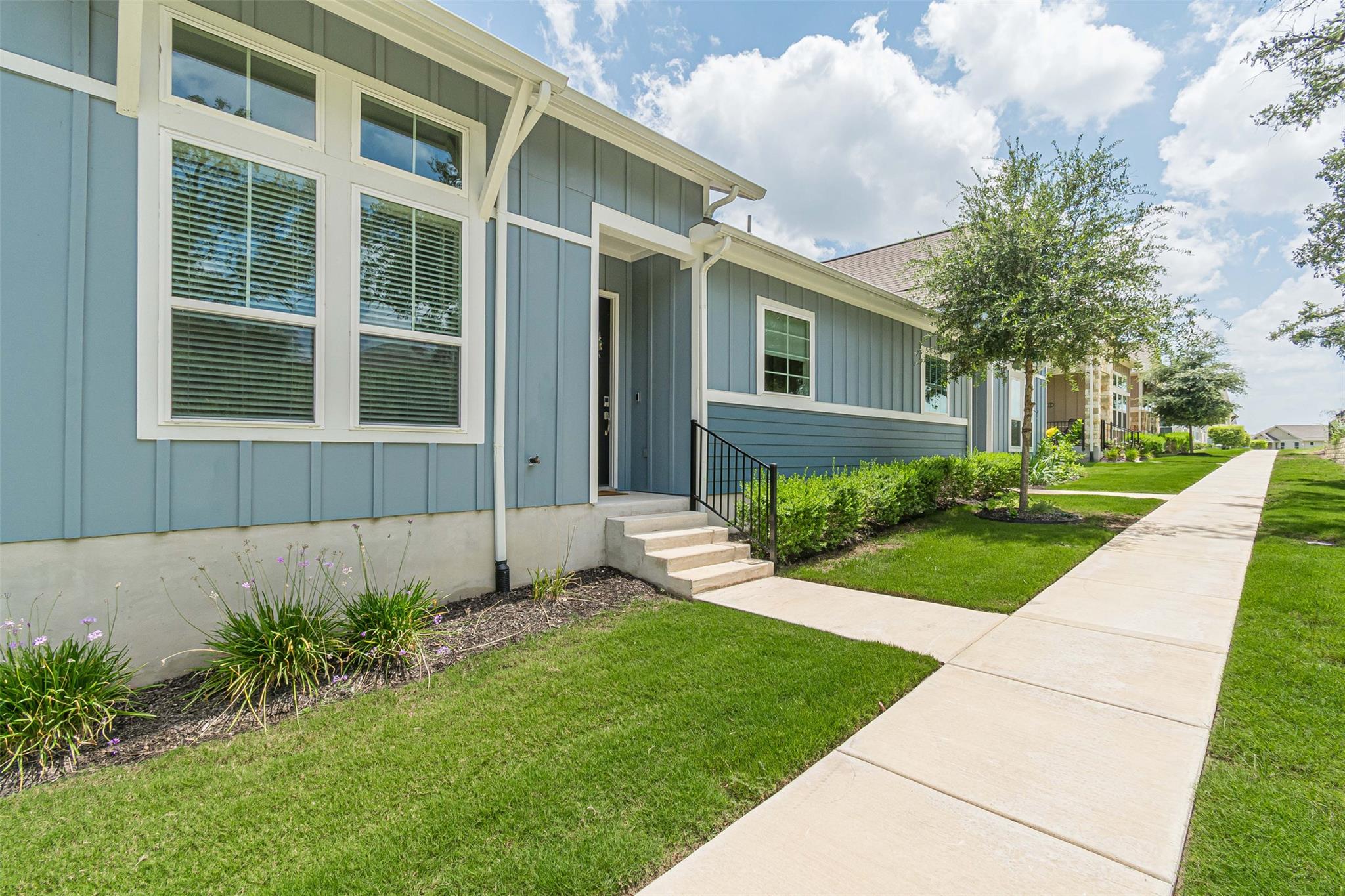 Well-maintained curb appeal with a verdant lawn a