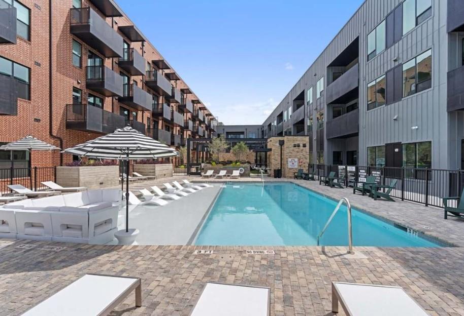 A refreshing pool with surrounding lounging areas