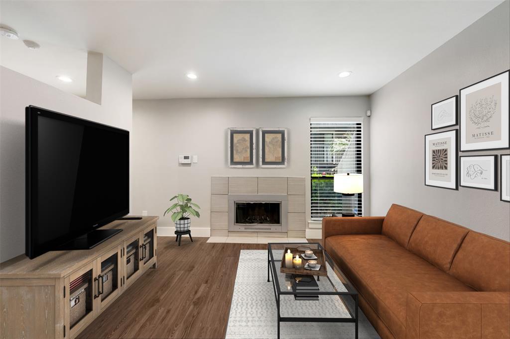 A well-appointed living area features warm wood f